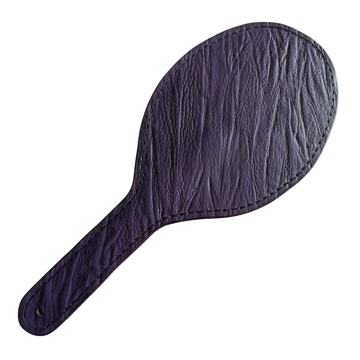 Oválná kožená plácačka z fialové kůže s reliéfem a s výstuhou. Cena 2700 Kč